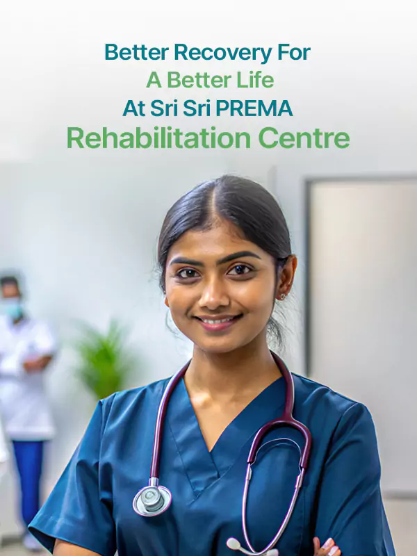 Smiling nurse at Sri Sri PREMA Rehabilitation Centre. Recovery for a better life.