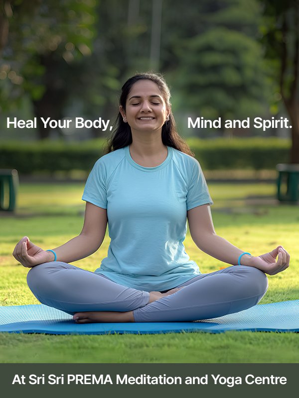 Woman meditating in lotus pose outdoors at Sri Sri PREMA Meditation and Yoga Centre. Heal your body, mind, and spirit.